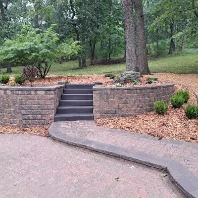 brick retaining wall with steps and walkway