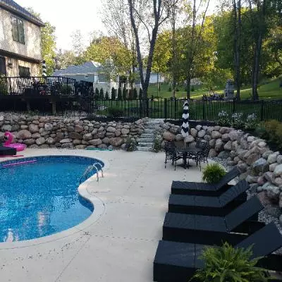 boulder retaining wall by pool