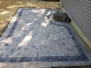 Decorative brick paver patio with colored trim