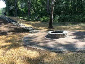 Ledge stone steps to lower level paver patio and fire pit