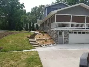 Porch to lower level concrete walkway and patio