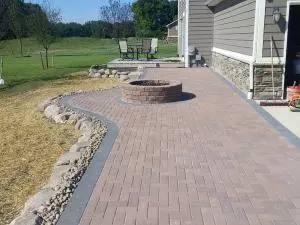 Brick fire pit on extended paver patio