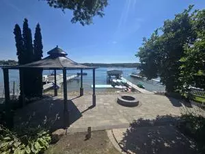 Lakeside fire pit with metal ring on large paver patio