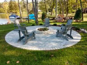 Lakeside fire pit with round paver patio surround